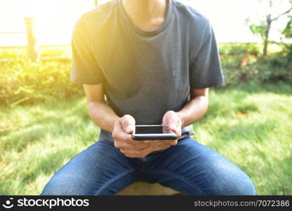 Man holding mobile smart phone using smart application by internet online