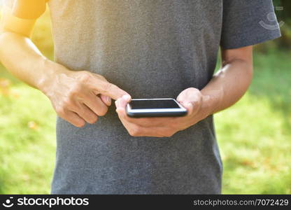 Man holding mobile smart phone using smart application by internet online