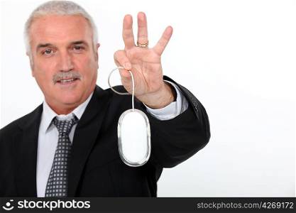 Man holding mouse of a computer in hand