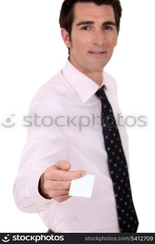 Man holding out his business card