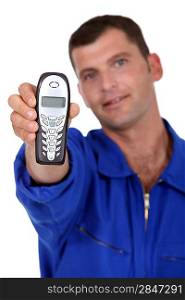 Man holding out telephone