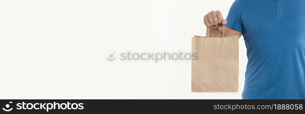man holding paper bag with copy space. Resolution and high quality beautiful photo. man holding paper bag with copy space. High quality and resolution beautiful photo concept