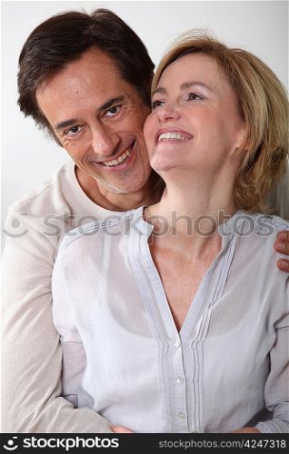 Man holding partner in arms