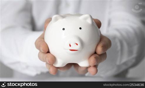 man holding piggy bank