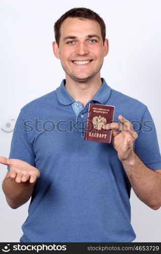 man holding russian passport