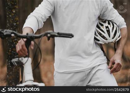 man holding safety helmet biking 2