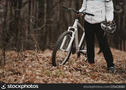 man holding safety helmet biking with copy space