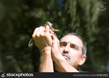 Man Holding Snake