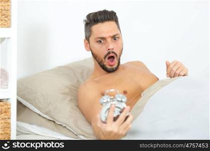 man holding the alarm clock