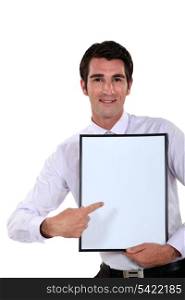 Man holding up a blank bulletin board