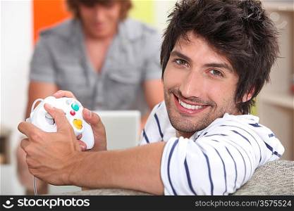 Man holding video game control pad