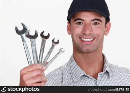 Man holding wrenches