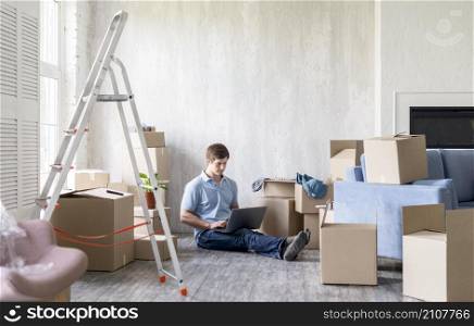 man home with boxes ladder getting ready move out