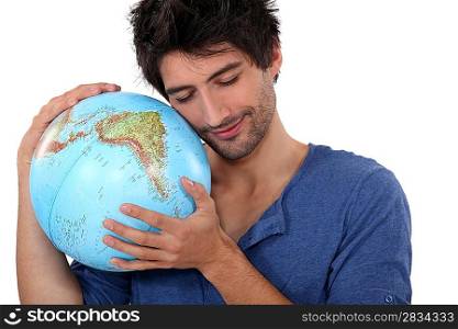 Man hugging a globe
