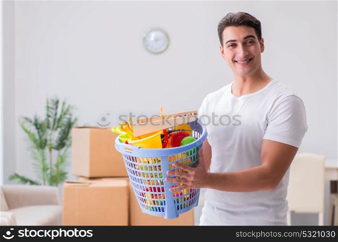 Man husband cleaning toy after kids
