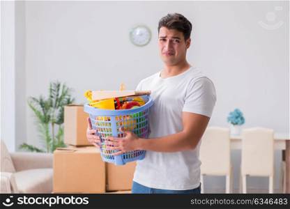 Man husband doing laundry at home