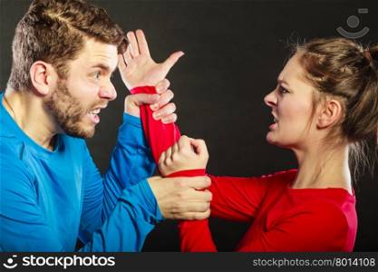 Man husband fighting with woman wife. Violence.. Husband fighting with wife. Aggresive man and woman in studio on black. Domestic violence aggression. Bad relationship.