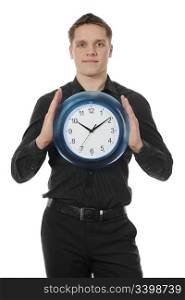 man in a black shirt holds clock