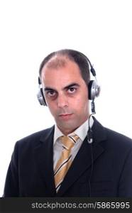 Man in a business suit listening to music on headphones