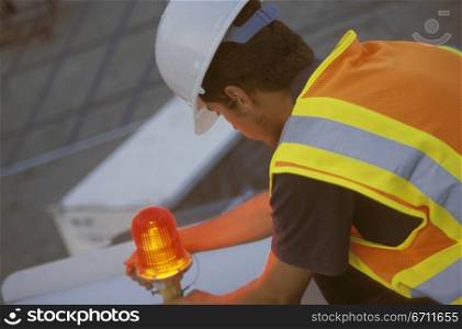 Man in a hard hat and refelctive jacket