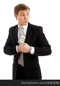 Man in a putting money in his pocket. Isolated over white