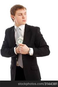 Man in a putting money in his pocket. Isolated over white