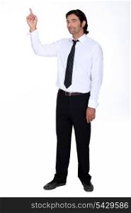 Man in a shirt and tie pointing upwards
