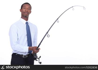 Man in a shirt and tie using a fishing rod