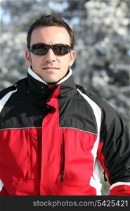 Man in a ski jacket and sunglasses