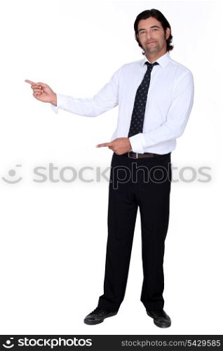 man in a suit pointing at something
