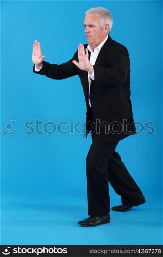 man in a suit pushing something
