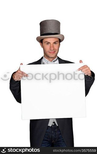 Man in a top hat and tails holding a board left blank for your message