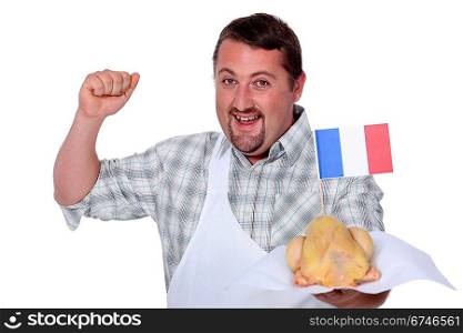 Man in a white apron celebrating French poultry