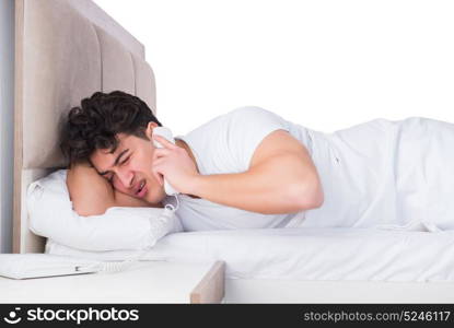 Man in bed suffering from insomnia