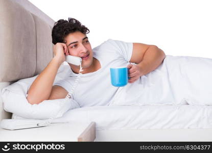 Man in bed suffering from insomnia