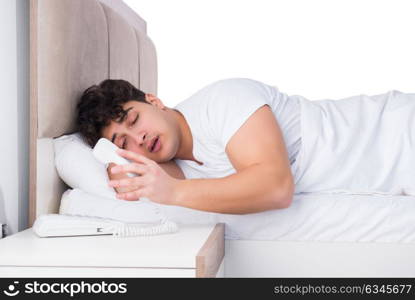 Man in bed suffering from insomnia