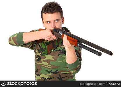 man in camouflage aims from gun