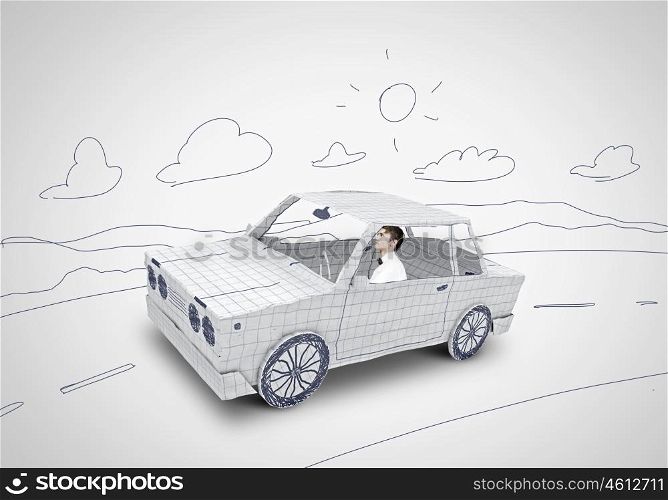 Man in car. Young man driving car made of sheet of paper