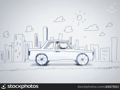 Man in car. Young man driving car made of sheet of paper