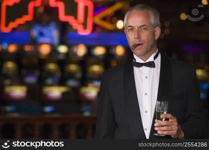Man in casino with cigar and champagne (selective focus)
