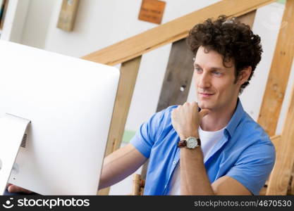 Man in casual wear working in office