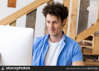 Man in casual wear working in office