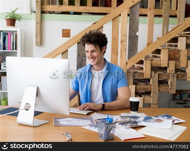 Man in casual wear working in office