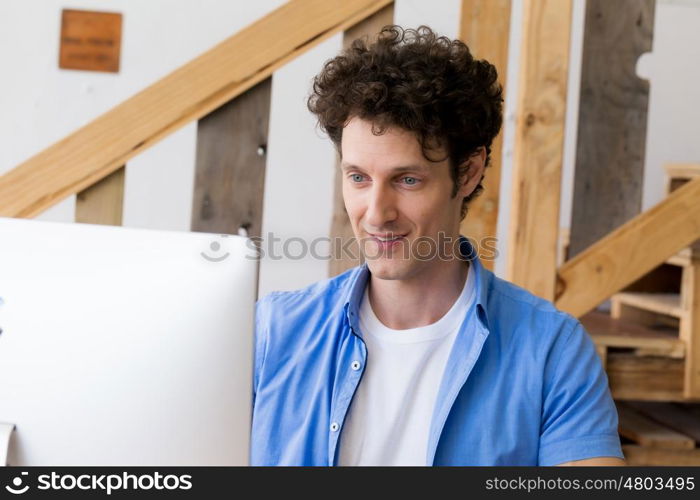 Man in casual wear working in office