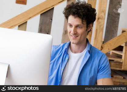 Man in casual wear working in office