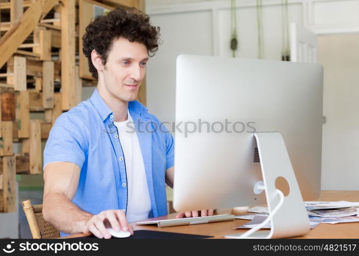 Man in casual wear working in office