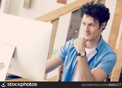 Man in casual wear working in office