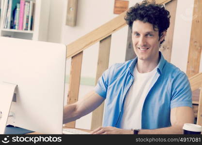 Man in casual wear working in office