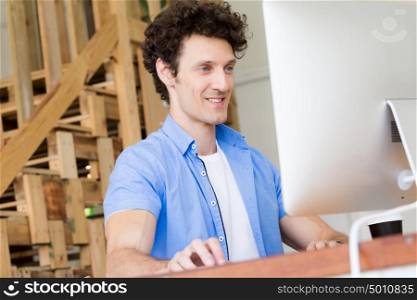 Man in casual wear working in office