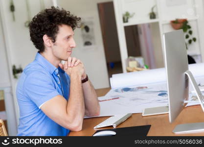 Man in casual wear working in office